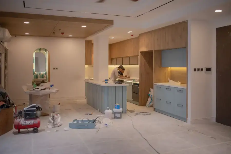 Cabinetry professionals installing custom cabinets during a kitchen remodel