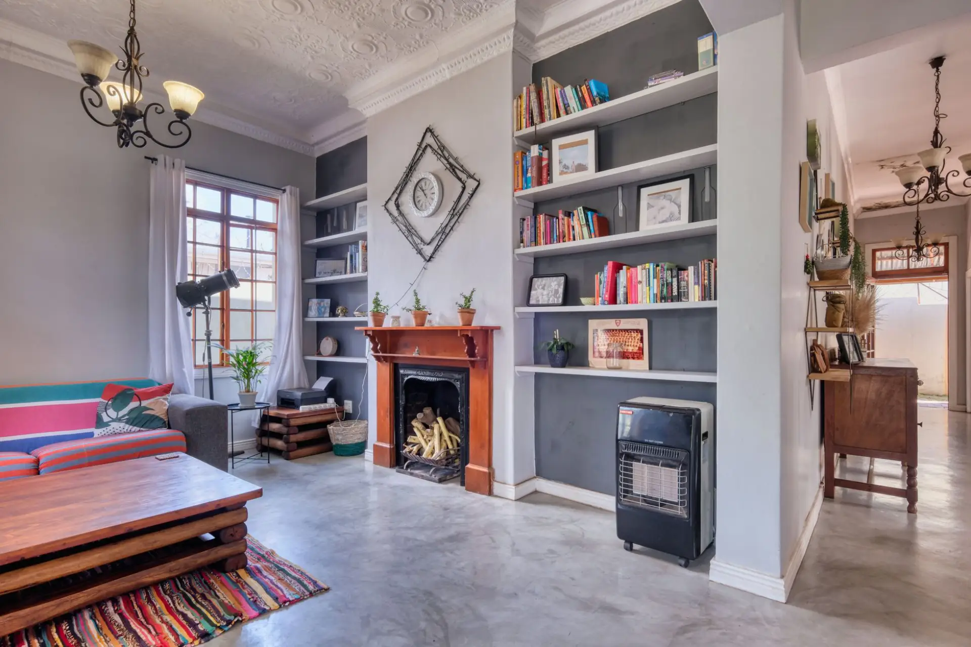 Stylish living room with built-in bookshelves flanking a fireplace and modern decor