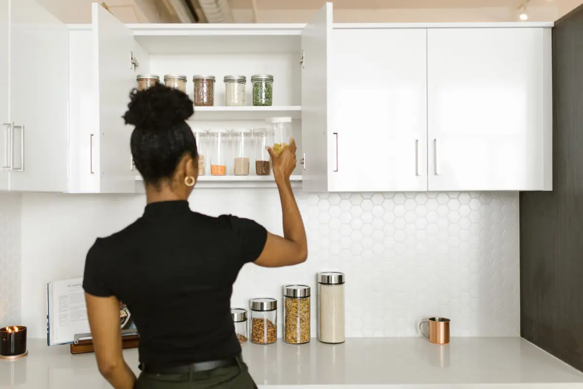 Pantry shelving organized with food storage jars and containers
