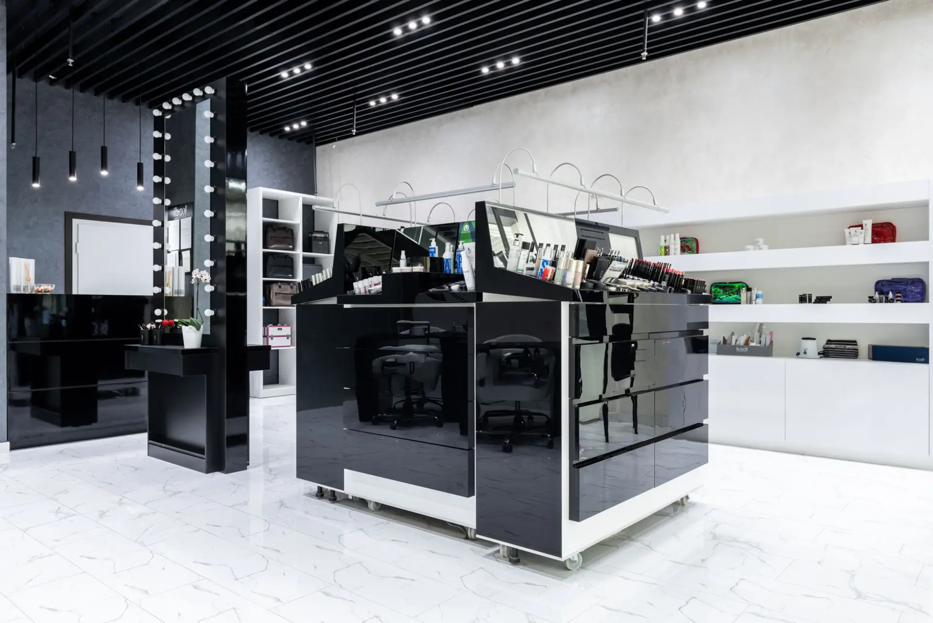 Sleek black and white retail store display island in a modern boutique